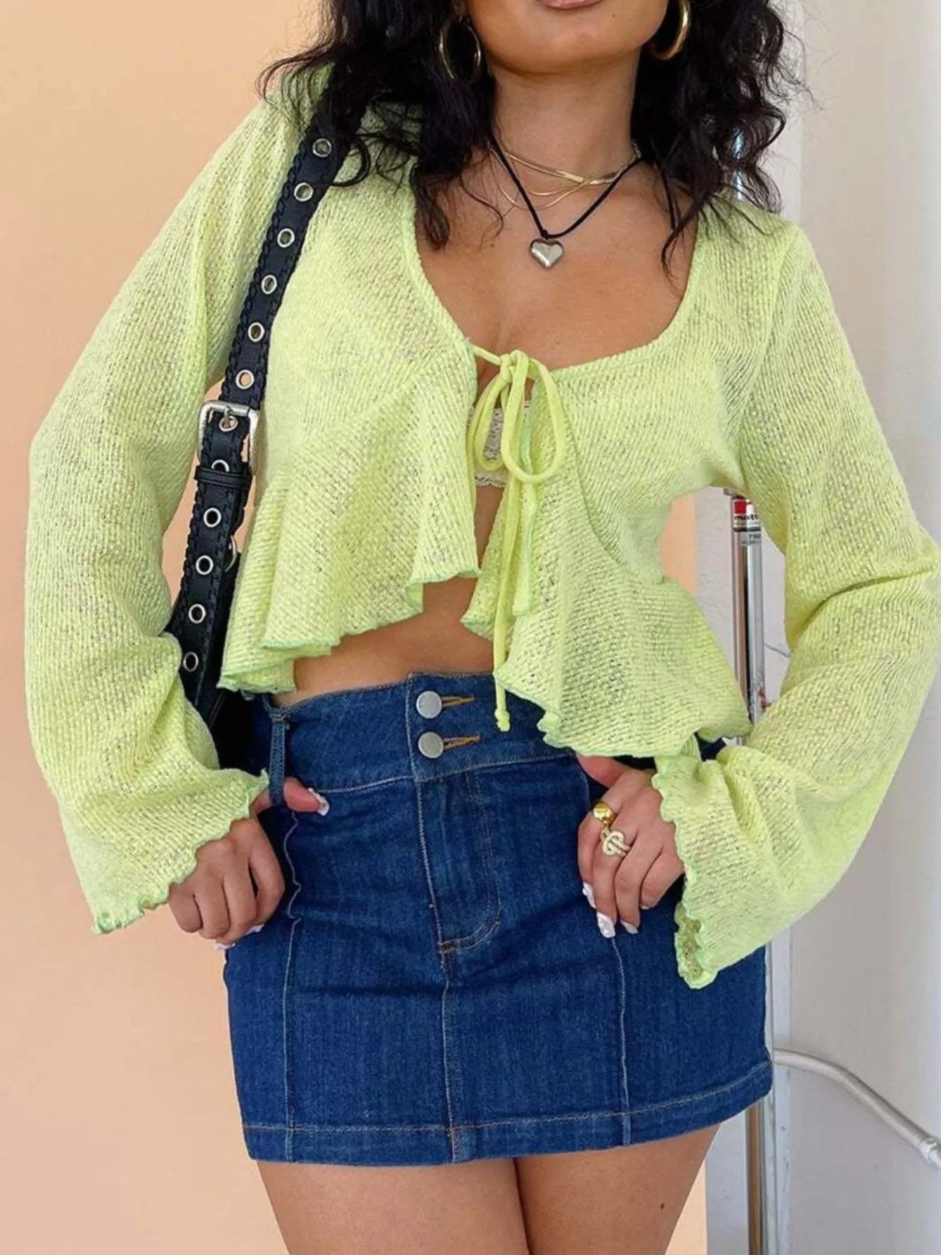 (Ruffled hem tie-front cropped cardigan front view)