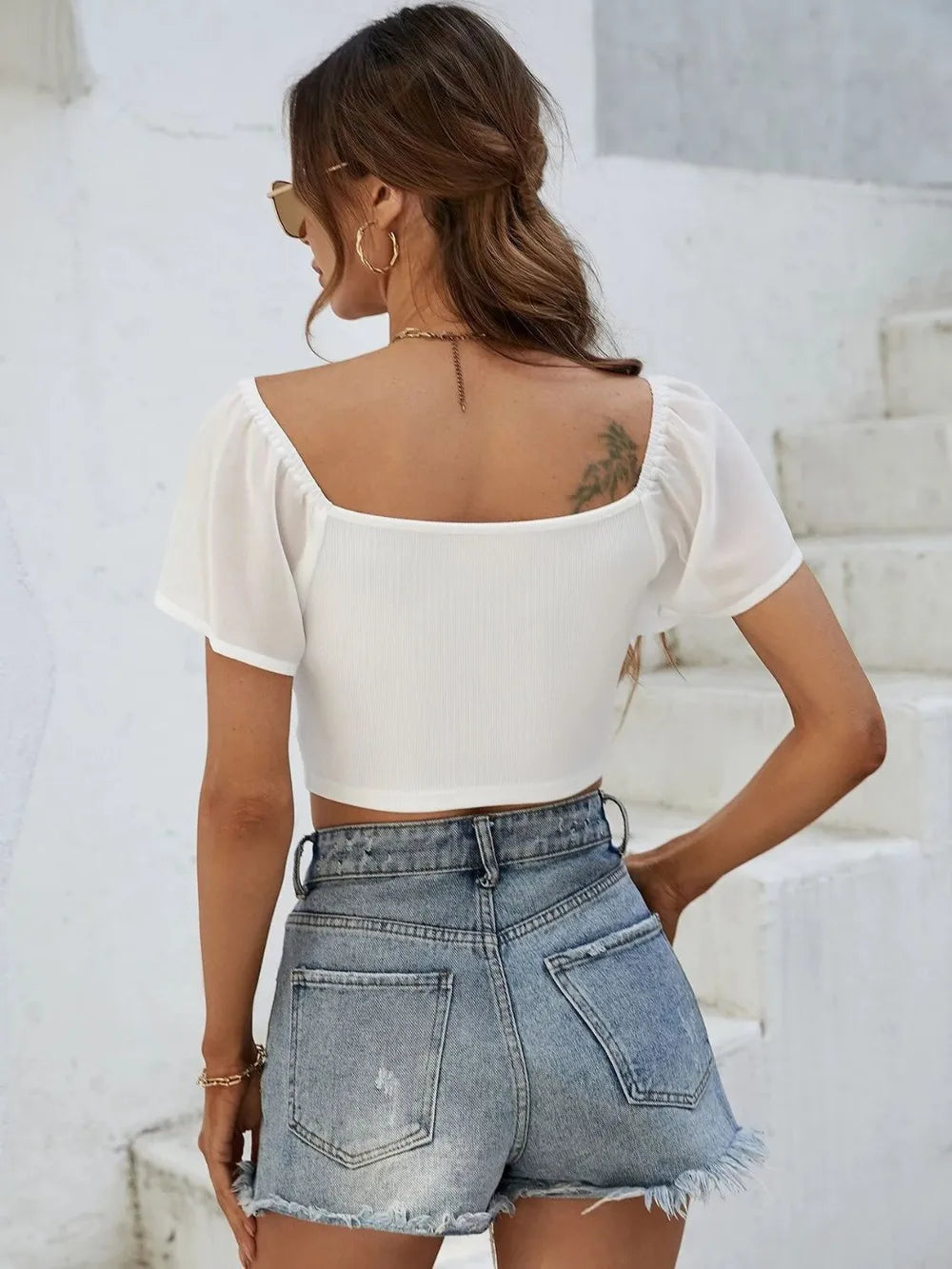 Back view of short sleeve crop top with drawstring waist