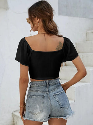 Back view of short sleeve crop top with drawstring waist