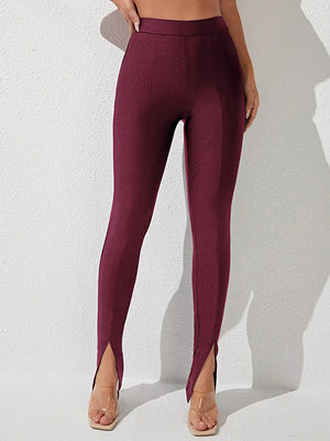 (Front view of high waist slit skinny pants with slit detail)