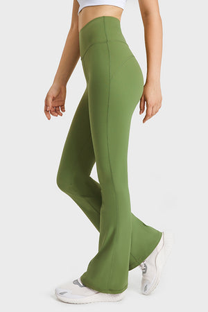side view capturing leg flare and smooth fit along the thigh and calf