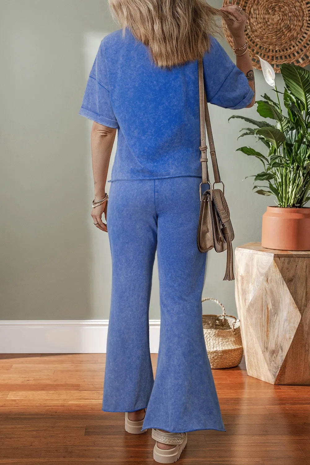 Back view of acid wash star patched top and pants set