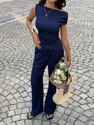 chic asymmetrical neckline top and pants set front detail view