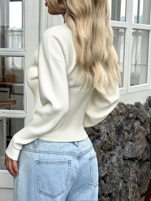 Back view of button-front cropped knit cardigan