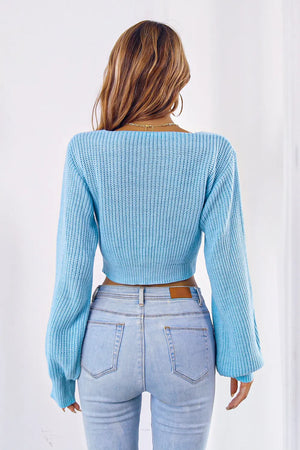 Back view of bow V-neck long sleeve cropped sweater