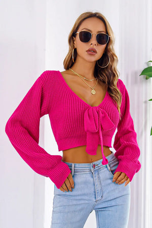 Front view of bow V-neck long sleeve cropped sweater