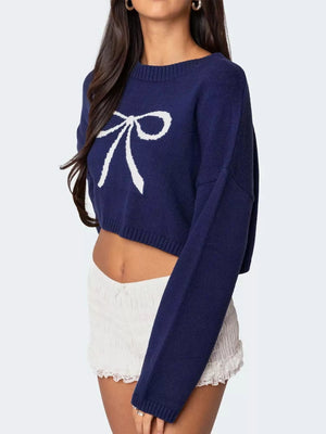 Close-up of bow detail on cropped sweater