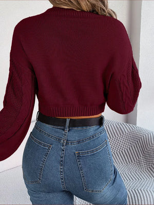 Rear angle view of cable-knit cropped sweater