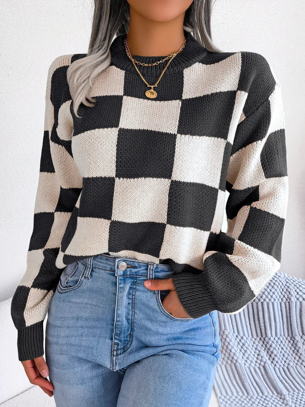 front view of checkered mock neck long sleeve sweater