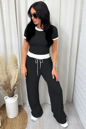 Front full look of contrast trim round neck top and pants set
