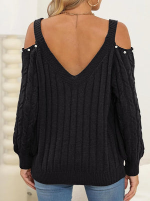 Back of Cable-Knit Cold Shoulder Sweater with cable knit pattern