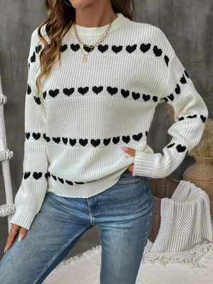 Front side of women’s heart print knit sweater with round neck