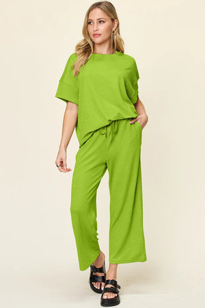 Front view of Double Take textured round neck short sleeve t-shirt and wide leg pants