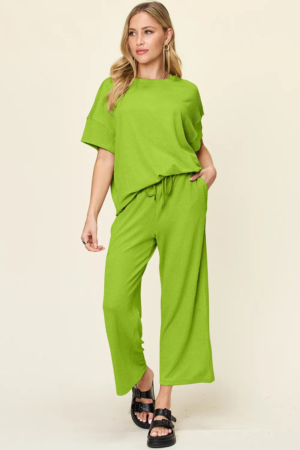 Front view of Double Take textured round neck short sleeve t-shirt and wide leg pants