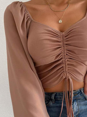 Front view focusing on fabric and color of cropped top