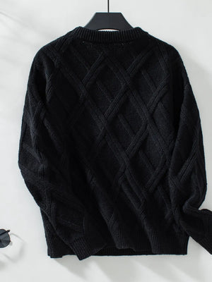 Women geometric sweater on hanger stylish winter clothing display