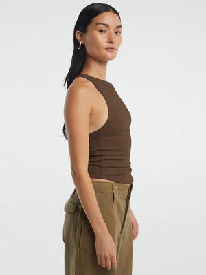 Side view highlighting the cropped top’s shape