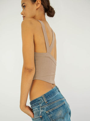 Side perspective highlighting cropped fit and neckline