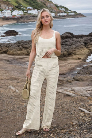 Front view of hollow out round neck top and pants sweater set