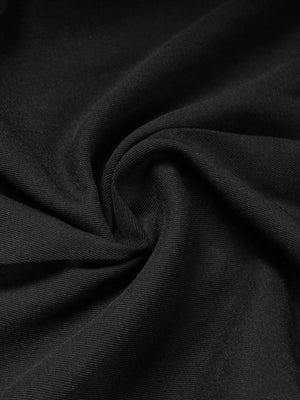 Waist detail of high-waisted wide-leg pants