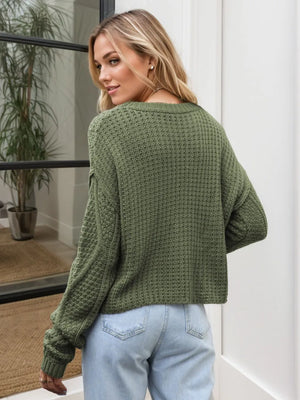 Back view cable knit sweater relaxed shoulder design