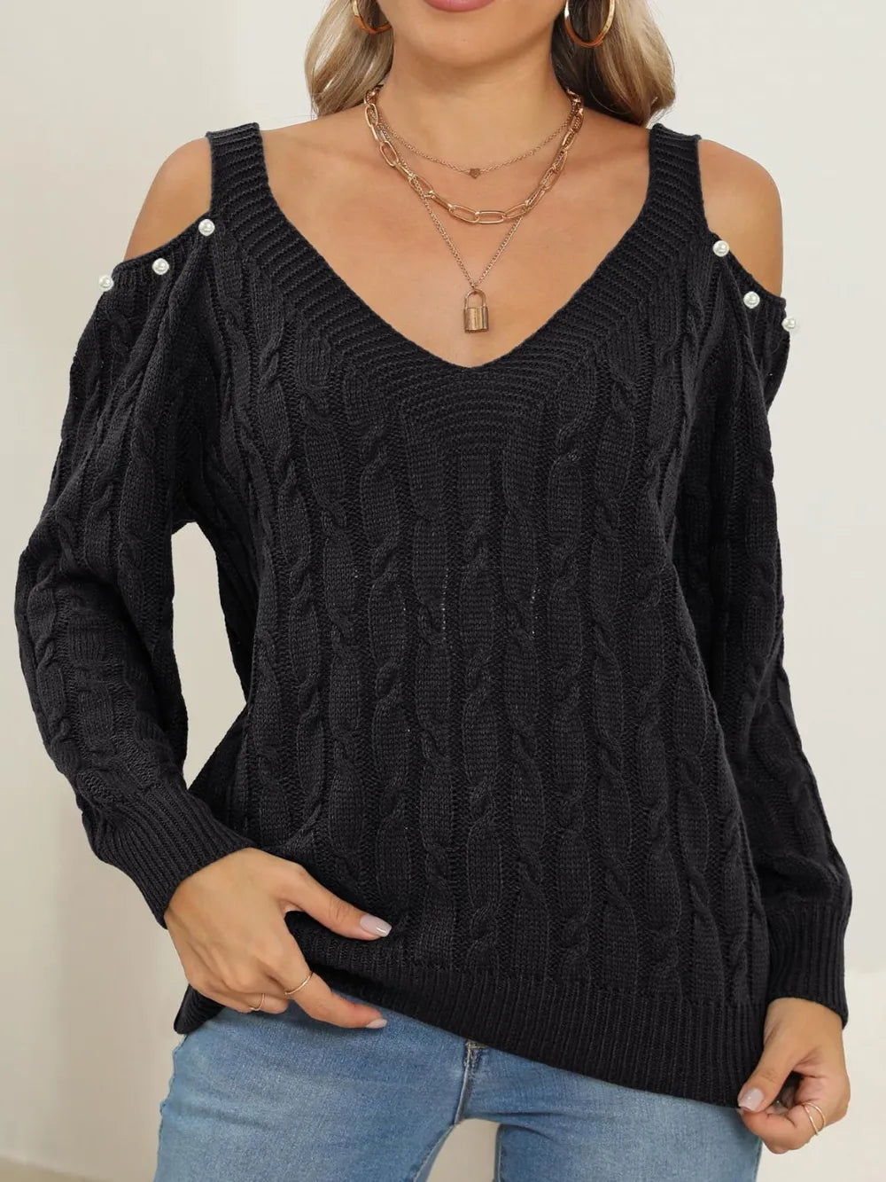 Front-facing Cable-Knit Cold Shoulder Sweater with trendy shoulder cutouts