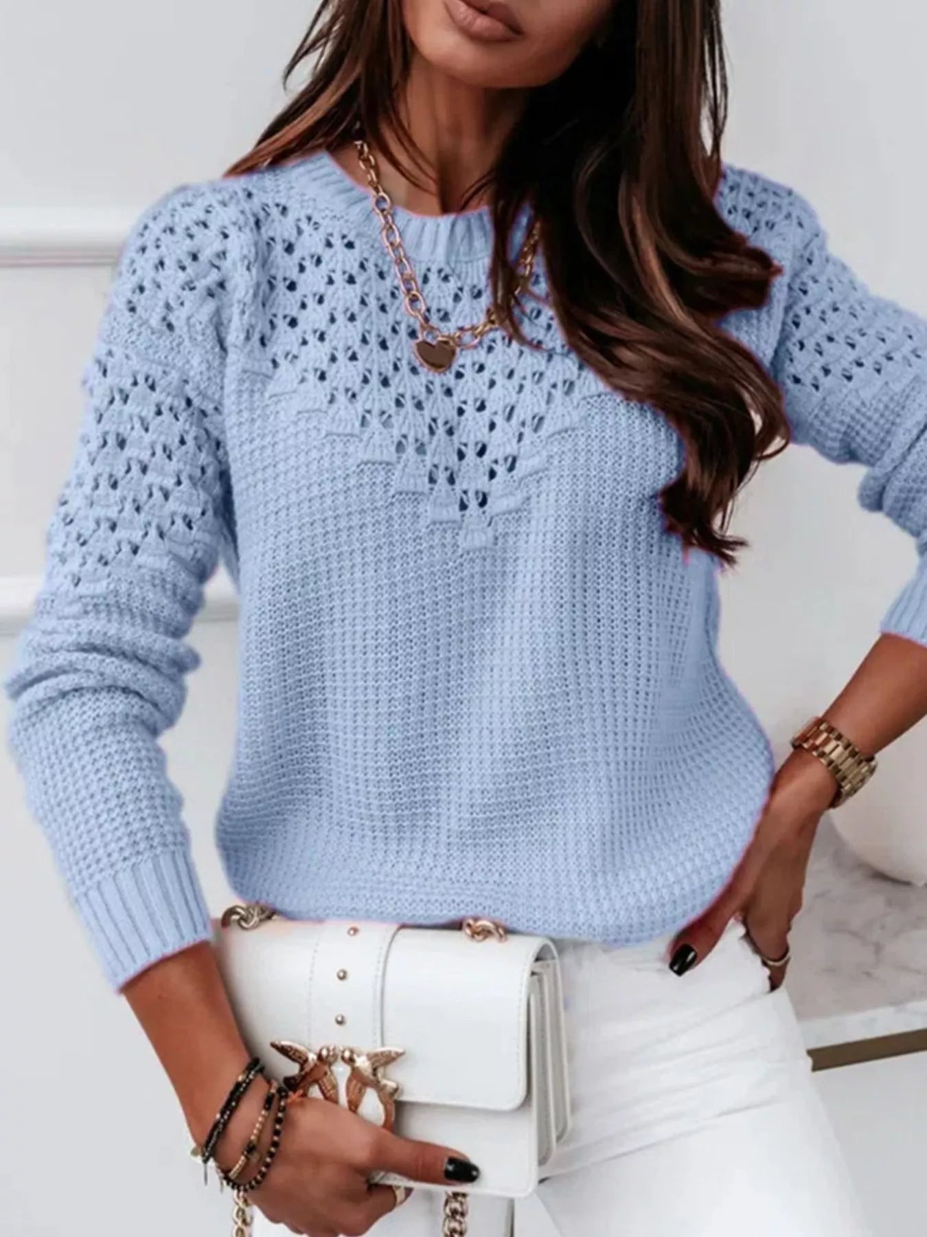 Close-up front view of textured knit sweater highlighting openwork details