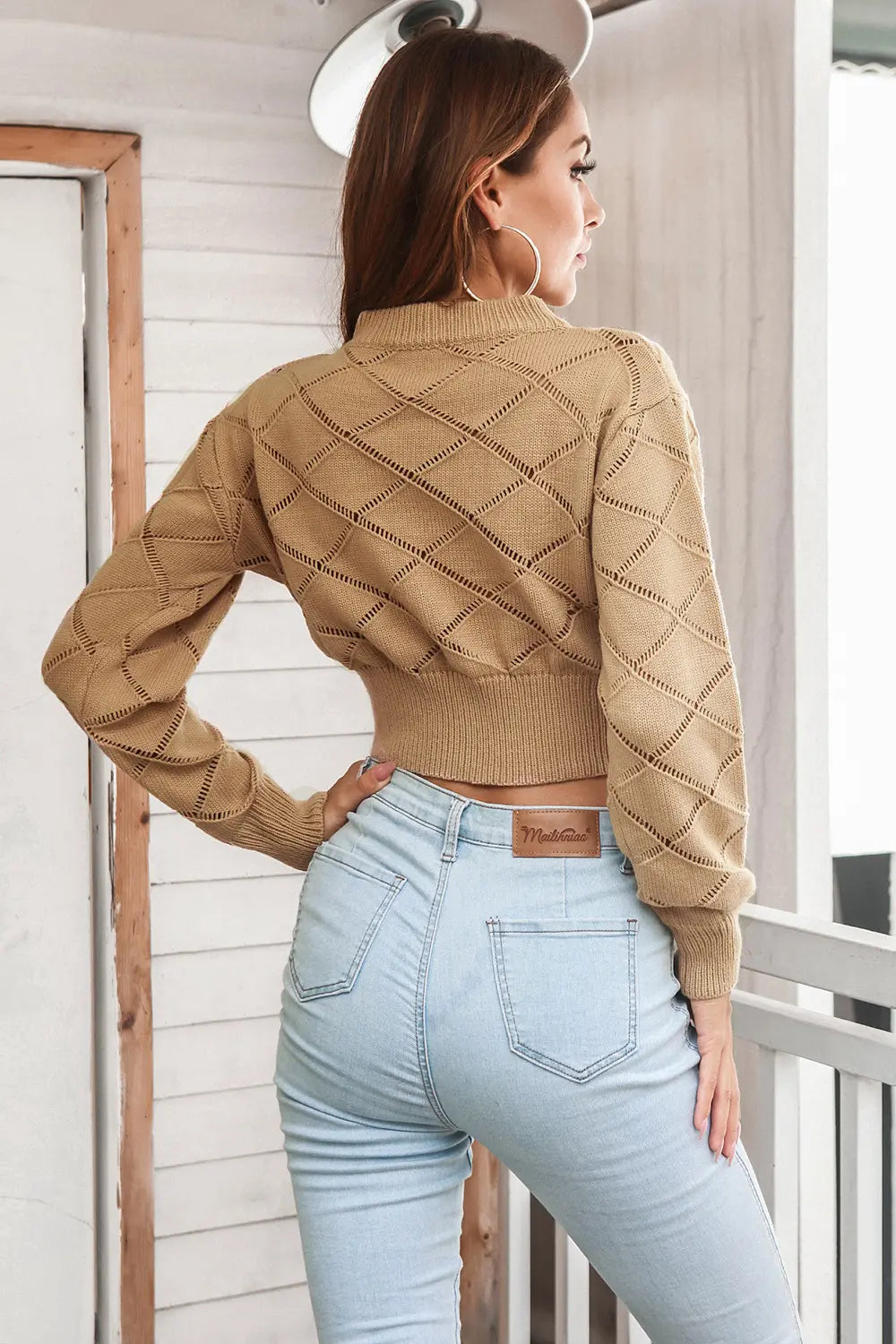 Back view of openwork plaid round neck cropped sweater