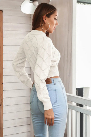 Side angle view showing fit of cropped plaid sweater