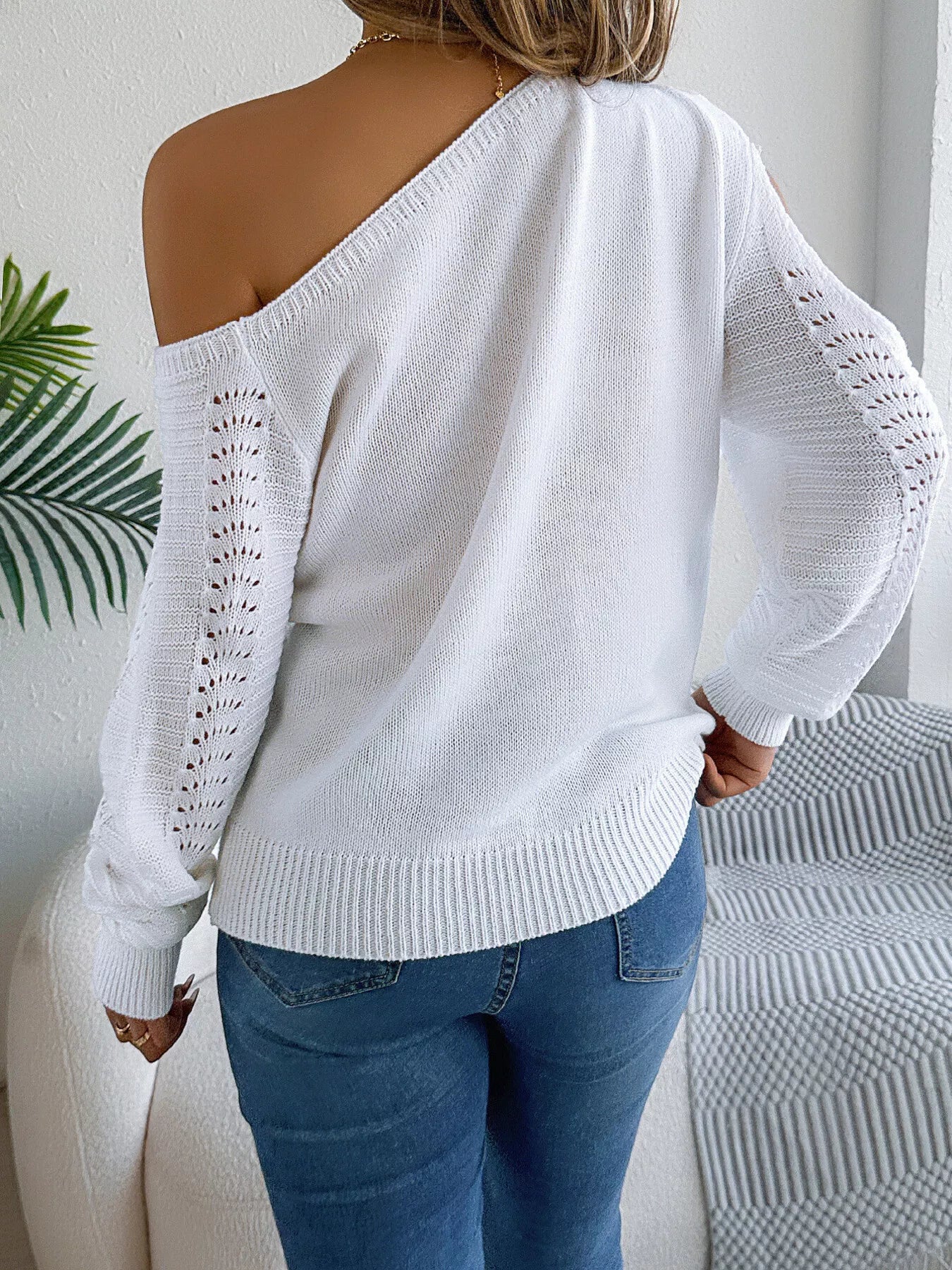 Back view of openwork one shoulder cutout sweater design