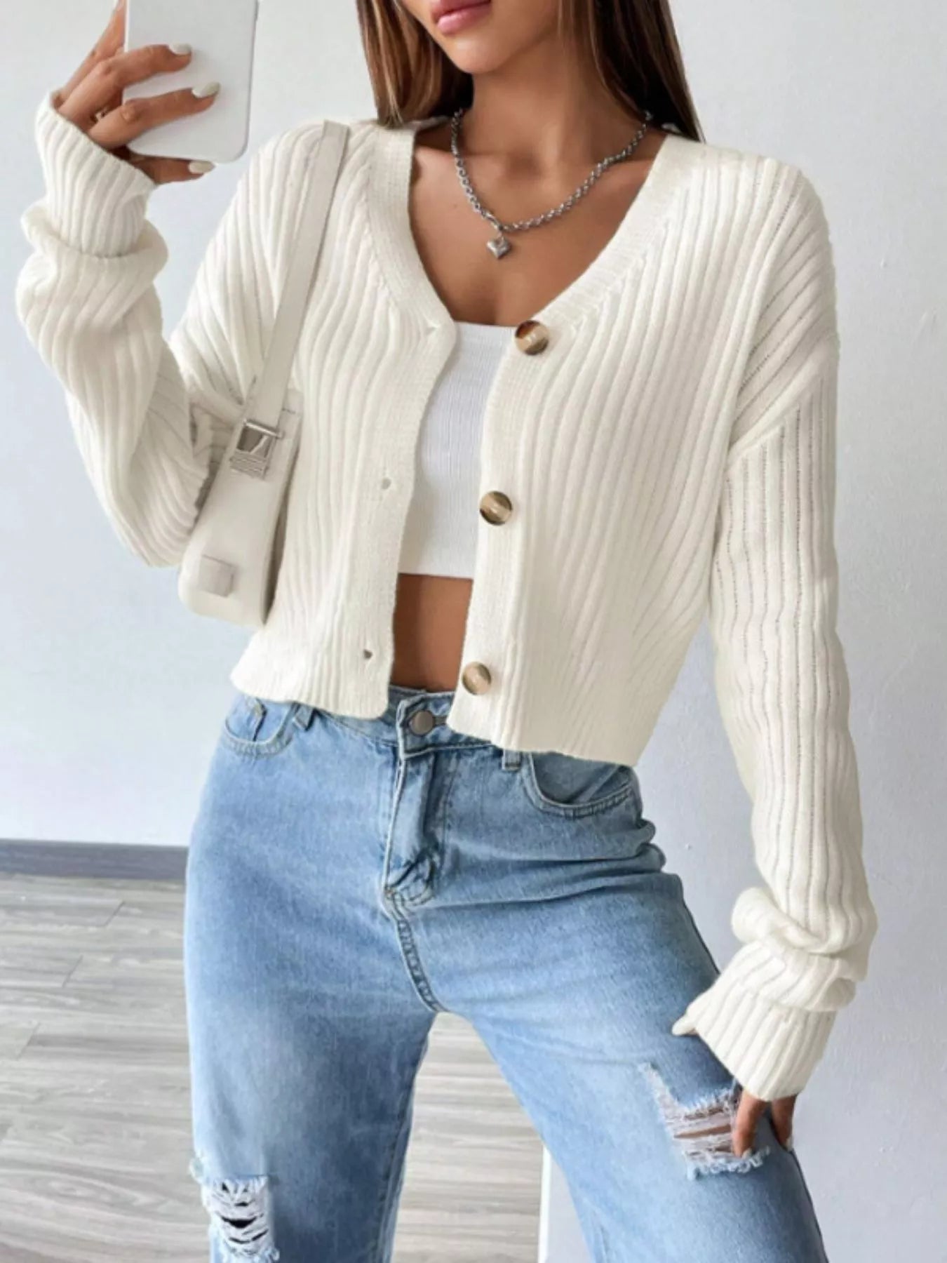 Front view of ribbed knit button-up cropped cardigan