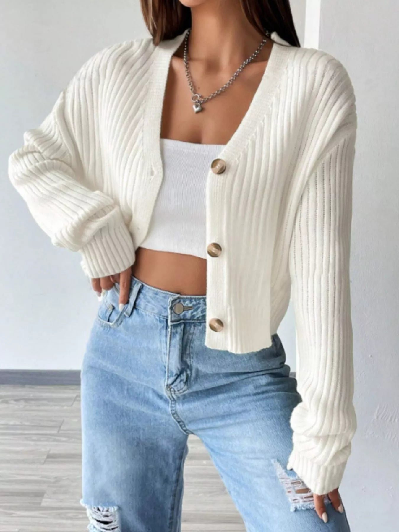 Front angle view of cropped ribbed knit cardigan