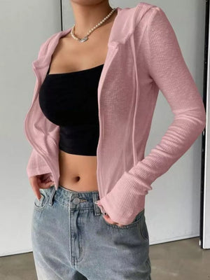 Angled view of ribbed knit cropped zip-up outerwear