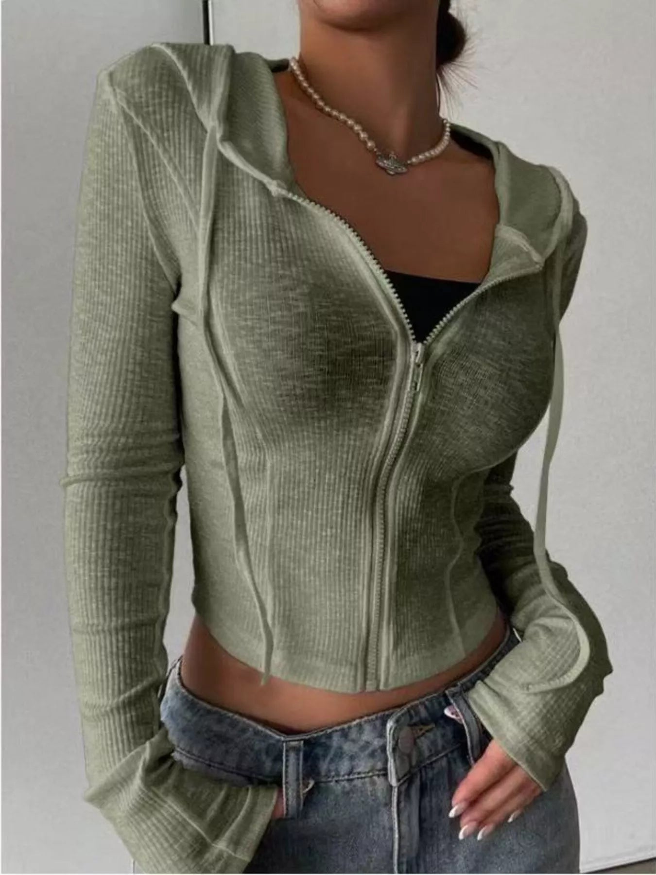 Front view of ribbed knit cropped zip-up outerwear