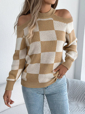 Full body front view of checkered cold shoulder sweater