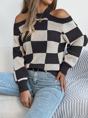 Front view of cold shoulder checkered long sleeve sweater