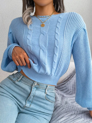 Side angled look of cable knit cropped sweater