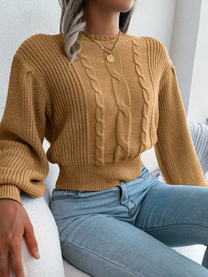 Fabric detail of cropped cable knit sweater