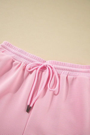 Textured top and wide leg pants arranged for detail