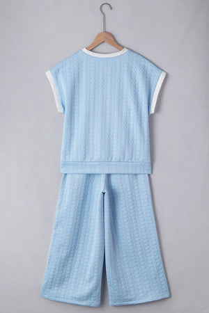 Two-piece textured outfit top and pants display