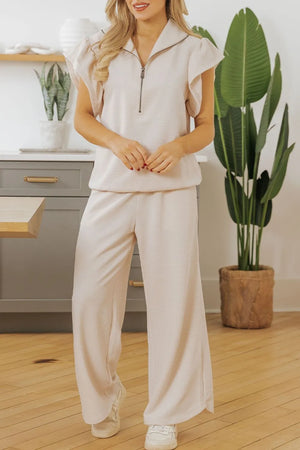 Front look of textured ruffled sleeve zipped top and pants set