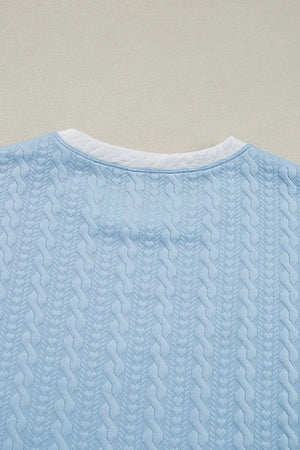 Textured top fabric and edge detailing