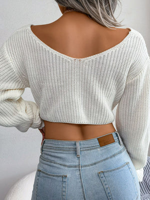 Back view of twisted front cropped sweater