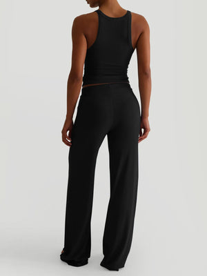 Back view highlighting cami straps and pants silhouette