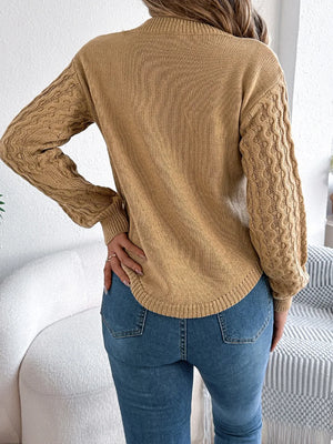 Back view of asymmetric hem round neck sweater