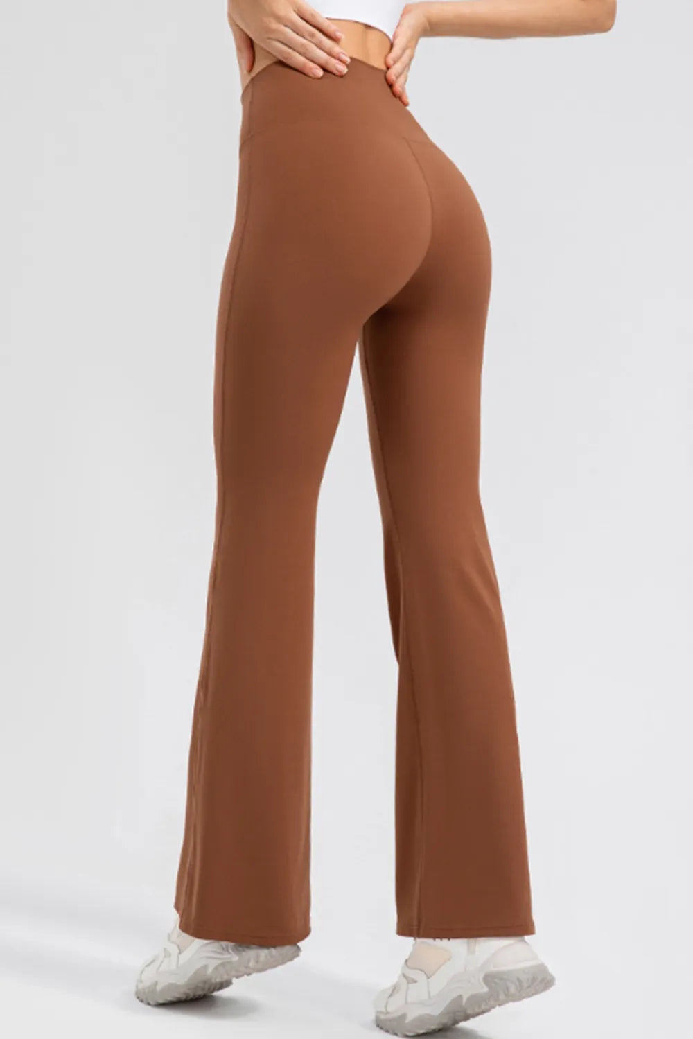 Back view displaying clean seam lines, wide waistband, and bootcut leg shape