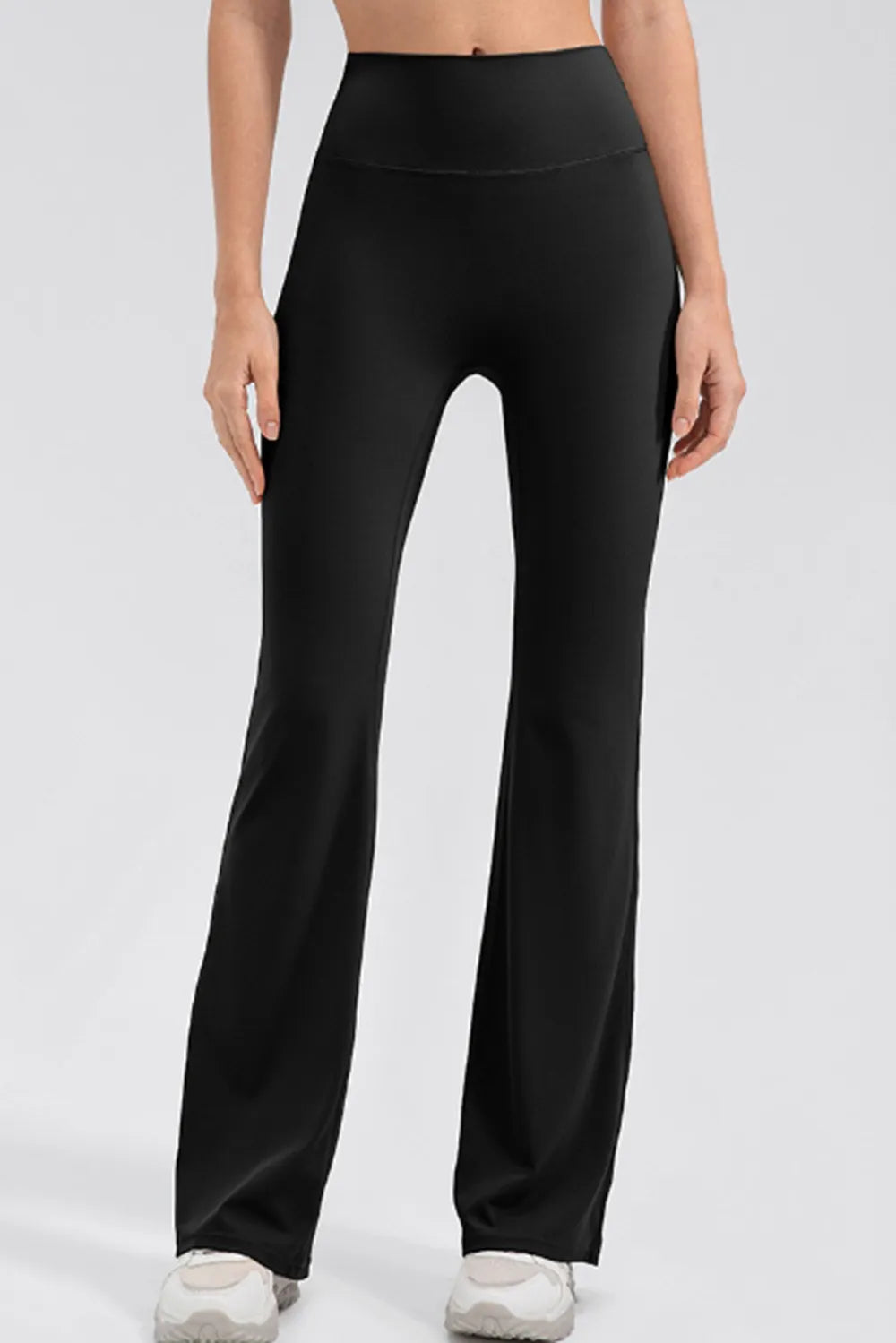 Front view of wide waistband bootcut leggings highlighting high waist fit and sleek leg line