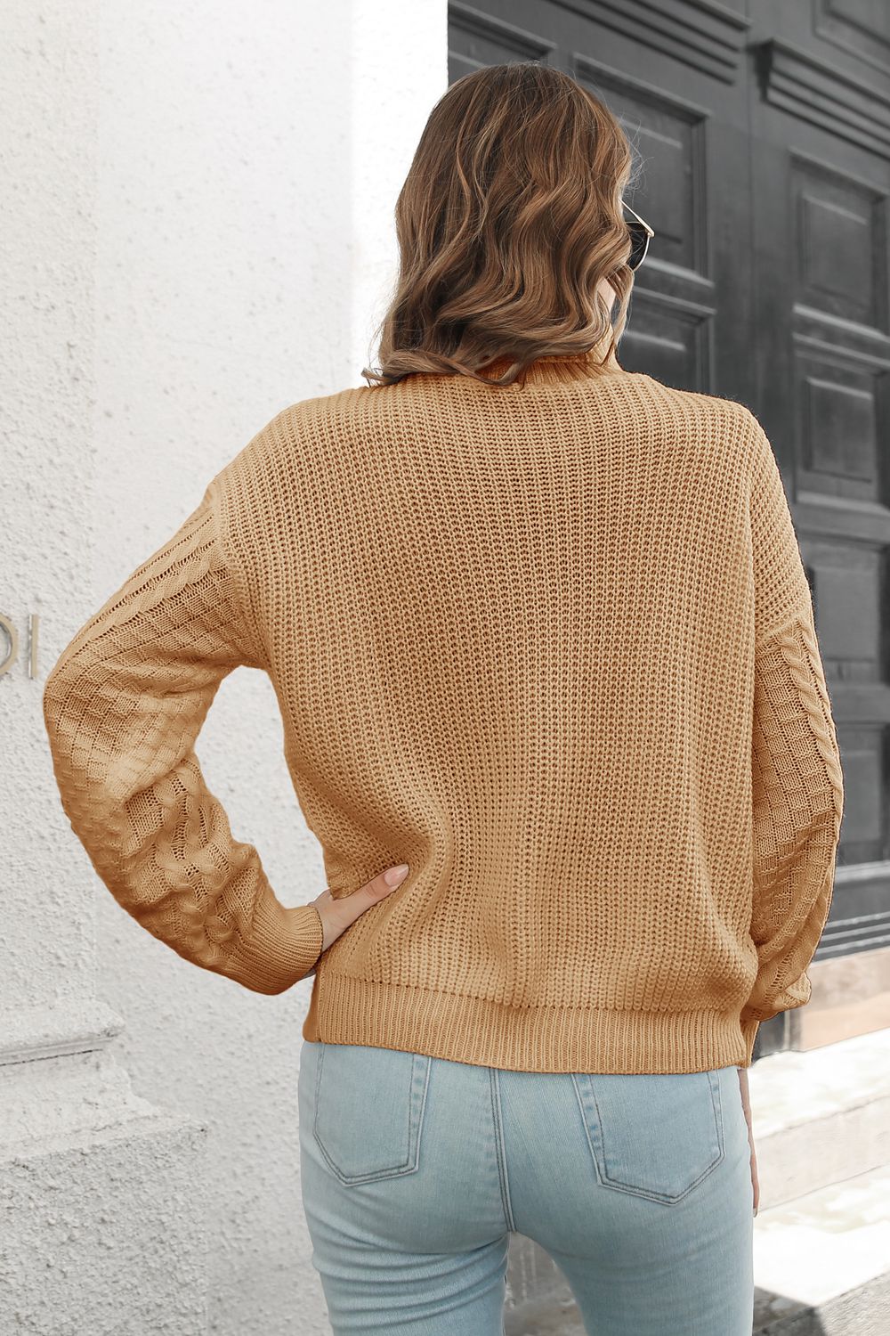Rear view of Cable-Knit Turtleneck Sweater highlighting back knit details