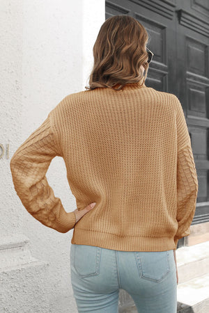 Rear view of Cable-Knit Turtleneck Sweater highlighting back knit details