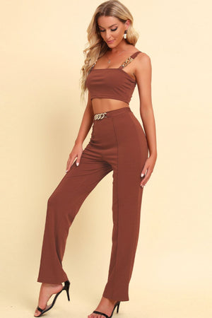 Side view highlighting chain detail on the cami and pants